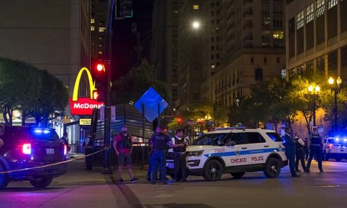 Two dead and eight injured after shooting outside a McDonald's in Chicago: Terrified witnesses scream and run as one victim suffers burns