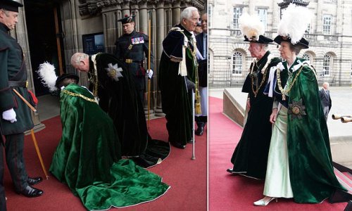 Hat's embarrassing! Princess Anne steps in to pick up brother Charles' feathered cap after it fell off as they stood in for their mother the Queen at the Order of the Thistle service in Edinburgh
