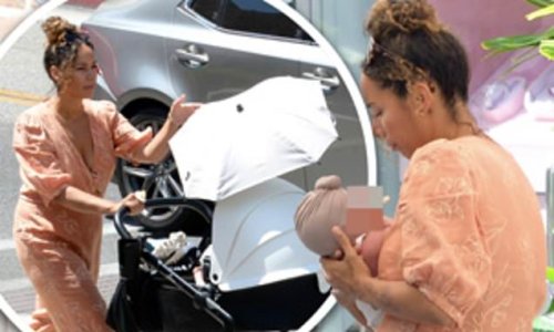 Leona Lewis is seen in public for the first time since giving birth as she enjoys a stroll with her newborn daughter Carmel in LA