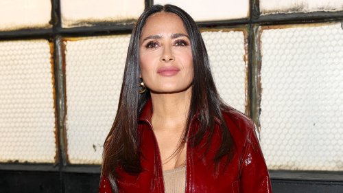 Salma Hayek is a vision in red PVC as she cosies up to billionaire husband François-Henri Pinault at...