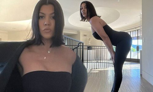 Kourtney Kardashian shows off her curves in a black tube top and Skims