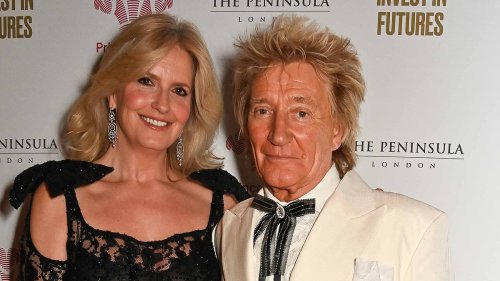 Penny Lancaster, 52, cuts a glamorous figure in a plunging black lace dress as she joins husband Rod...