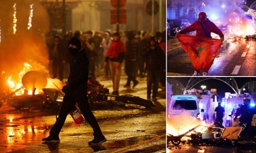 Belgian riot police fire tear gas and water cannons at violent crowds setting fires and smashing cars in Brussels as world No2 side Belgium LOSE to Morocco 2-0 in another major Qatar World Cup upset