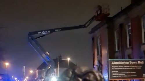 Bizarre moment man 'steals' cherry picker outside town hall
