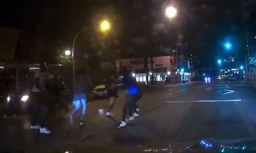 Sickening moment car plows through group of men fighting in Chicago road and sends their bodies flying into the air before racing off: Three dead, one injured