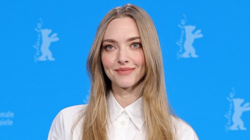 Amanda Seyfried gives a glimpse of her tummy in cropped shirt at the photocall for her film Seven...