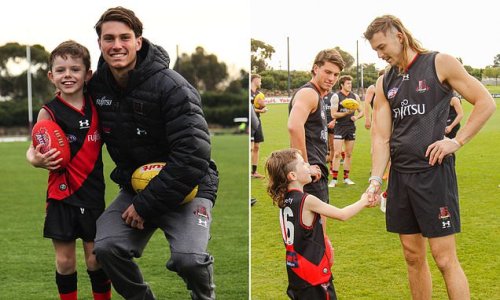 Auskicker's dream comes true as Essendon invite young fan to The Hanger for a day with 'hero' Archie Perkins - with youngster providing Bombers squad a morale boost after shocking start to the season