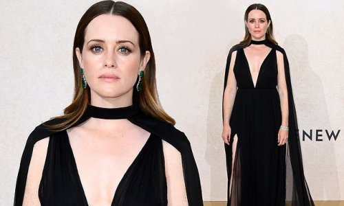 Claire Foy looks stunning in a plunging black gown with matching cape as she joins stars at the amfAR gala during the Cannes Film Festival