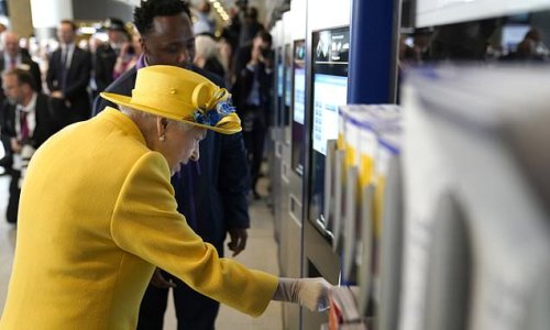 One doesn't carry cash! The Queen, 96, is shown how to top up an Oyster card during surprise visit to Paddington Station to open the Elizabeth line with Prince Edward - after calling off State Opening speech due to 'mobility issues'