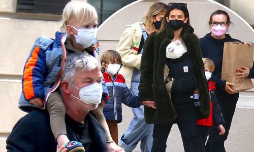 Alec Baldwin and Hilaria take four of their six children for a walk