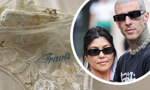 Travis Barker shows off wife Kourtney Kardashian's VERY sexy lace underwear inscribed with his NAME
