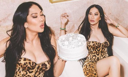 Kimora Lee Simmons rings in 47th birthday by slipping back into busty leopard dress she first wore 17 YEARS AGO for sizzling bathtub shoot