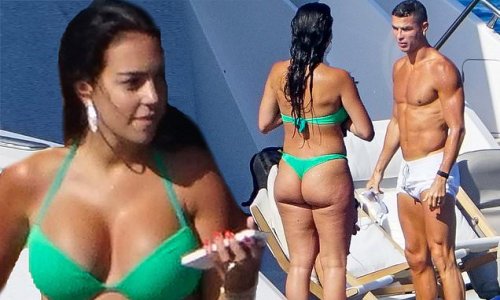 Cristiano Ronaldo shows off his chiselled abs and zooms around on a jet ski as he joins bikini-clad Georgina Rodríguez on a yacht in Ibiza