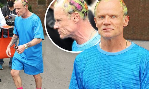 Red Hot Chili Peppers bassist Flea shows off colorful 'do and blue and pink ensemble as he makes his way from NYC hotel to band's show at MetLife Stadium in NJ