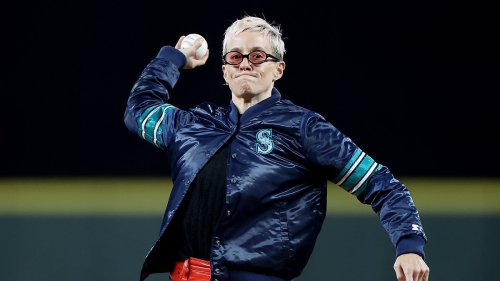 Megan Rapinoe brandishes a trident and takes selfies on the mound as she throws out the first pitch for the Seattle Mariners... just days after playing her final ever USWNT game