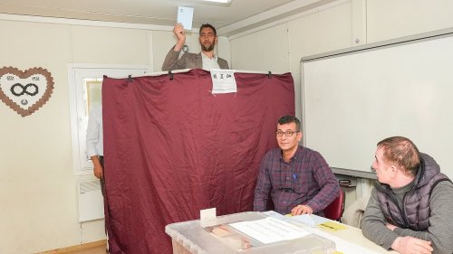 The world's tallest man who stands at 8ft 3in votes in Turkey's elections - as 61million cast...
