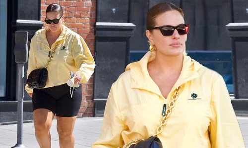 Ashley Graham works black biker shorts and a Bottega Veneta bag