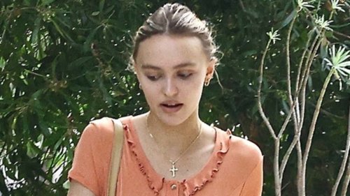 Lily-Rose Depp puts on a stylish display as she goes braless underneath orange minidress while house hunting in Los Angeles