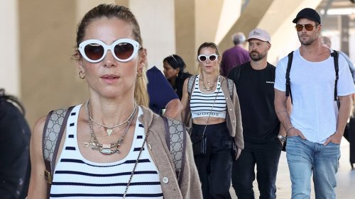 Elsa Pataky flaunts her toned midriff with Chris Hemsworth at airport