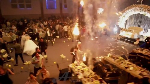 Revealed: Iraqi bride lost her 'entire family' including three brothers and groom's mother in wedding inferno that left 100 dead - as terrifying new video shows joy turn to horror inside burning hall during first dance