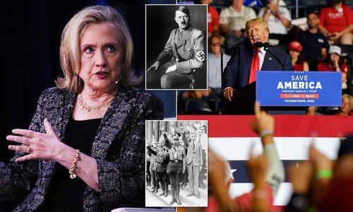 Hillary Clinton compares Trump fans to NAZIS who were 'drawn in by Hitler' as she claims supporters at his Ohio rally performed an Qanon index finger salute - Trump camp calls her attack 'pathetic and divisive'