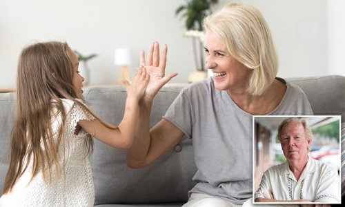 Do YOU high-five your kids? Parenting expert sparks furious debate after insisting that adults should never 'slap the upraised palm' of a child under 21 - because it teaches a lack of RESPECT