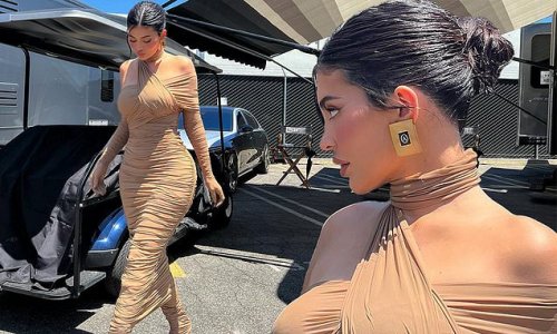 'Days on set': Kylie Jenner shows off sexy curves in a clingy beige dress and matching heeled boots while shooting season two of Hulu's The Kardashians