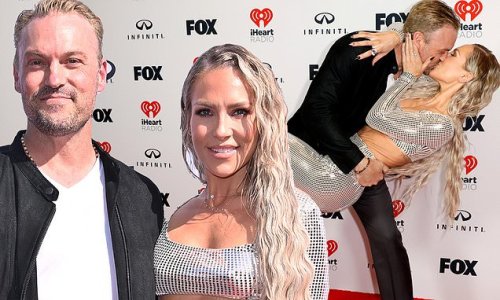 Brian Austin Green is nearly UNRECOGNIZABLE with new blonde locks as girlfriend Sharna Burgess flaunts toned postpartum frame in sparkling ensemble at iHeartRadio Music Awards