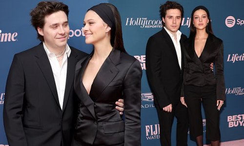 Brooklyn Beckham and his glamorous wife Nicola Peltz put on a loved-up display as they join arrivals at THR's Annual Women in Entertainment Gala