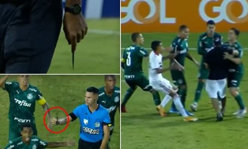 Sao Paulo fans fling a KNIFE onto the pitch and invade the field