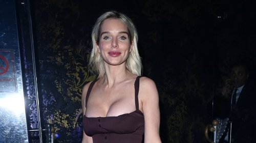 Helen Flanagan puts on a VERY busty display in a chocolate brown corset dress as she steps out for dinner in Manchester