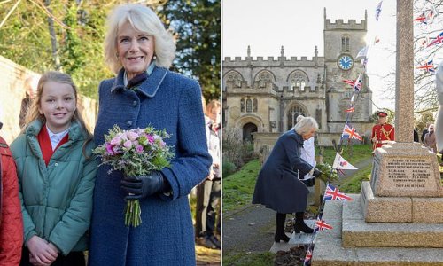 Duchess of Cornwall is elegant in blue as she's greeted by schoolchildren before laying flowers to mark the 100th anniversary of Second World War Memorial during visit to Wiltshire