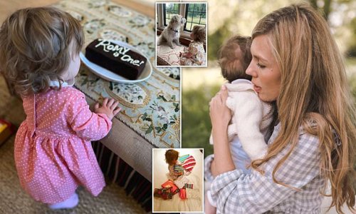 Happy 1st birthday Romy! Boris Johnson's daughter celebrates her big day with a pile of presents, chocolate cake, and cuddles with Dilyn the dog