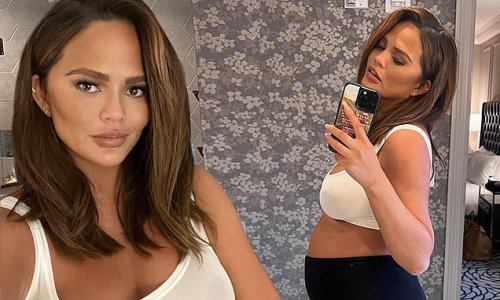 Chrissy Teigen Dons White Sports Bra As She Puts Her Ample Cleavage On Display While Showing Off 