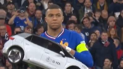 Hilarious footage emerges of baffled Kylian Mbappe removing a remote controlled car from the pitch after it broke down before France's Nations League clash with Croatia