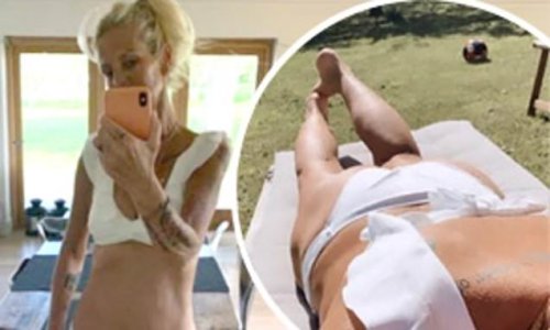 Ulrika Jonsson, 54, shows off her svelte figure in a white bikini as she strips off to soak up the sunshine in her back garden