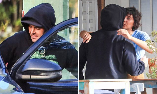 There he is! Hollywood star Zac Efron is finally spotted hiding out in Byron Bay after weeks of speculation and gets VERY friendly with the locals... including a brunette beauty