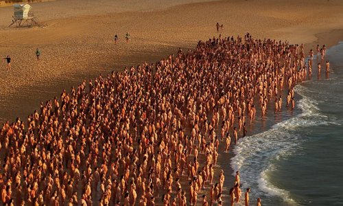 Bondi is transformed into a 'nude beach' as famous photographer Spencer Tunick snaps thousands of Sydneysiders at dawn in their birthday suits