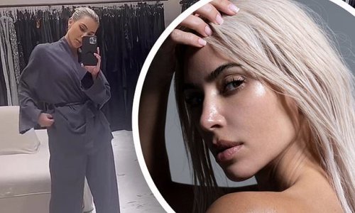 Kim Kardashian shows off her flawless complexion as she goes topless to advertise her skincare line before modeling her new SKIMS pajamas
