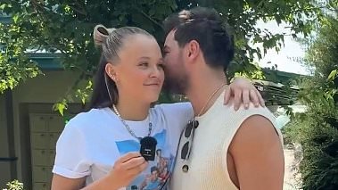 Chris Hughes makes racy confession amid JoJo Siwa romance as the pair look cosy in new clip - after their relationship was finally confirmed