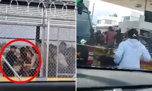 Moment hundreds of migrants rush across the Mexico-United States border bridge to reach Texas, knocking down Mexican border agent while children fell to the ground and were trampled