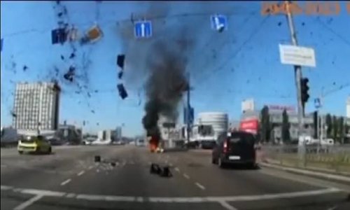 The luckiest driver in Kyiv: Motorist is inches from death when Russian missile comes down beside their car