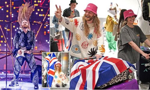British Eurovision hero Sam Ryder salutes Ukraine by wearing winner Oleg Psiuk's trademark pink hat as he returns home after UK's best result in 20 years