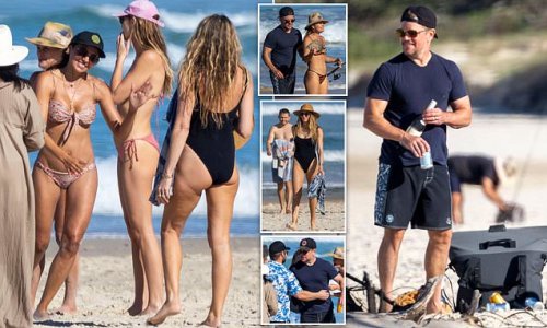 Catch of the day! Matt Damon enjoys a boozy fishing day at a beach in Byron Bay with his stunning bikini-clad wife Luciana Barroso and the Hemsworth clan