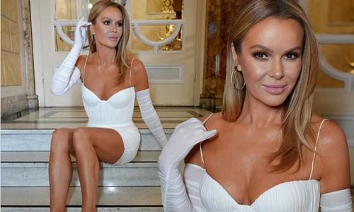 Amanda Holden puts on a leggy display in a busty white corset mini dress as she poses for snaps while filming Britain's Got Talent in London