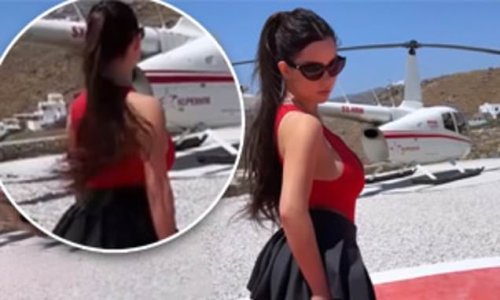 Demi Rose sets pulses racing as she flaunts her peachy posterior in a TINY black miniskirt while posing next to a helicopter