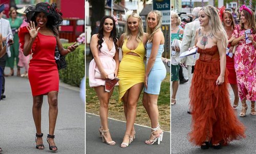 Frill seekers! Glamorous racegoers pull out all the fashion stops in colourful frocks and elaborate fascinators for Ladies' Day at York Races