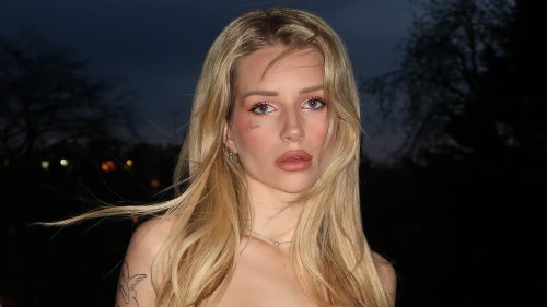 Lottie Moss shows off her tattoos in a cute little black dress ahead of her glam night out at...