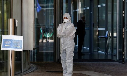 Emergency services in Hazmat suits descend on EU headquarters in Brussels after 'suspicious white powder' is found near President Ursula Von Der Leyen's office