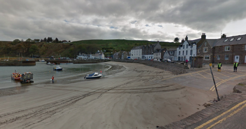 Man charged with 'number of road offences' after car gets stuck on Scots beach